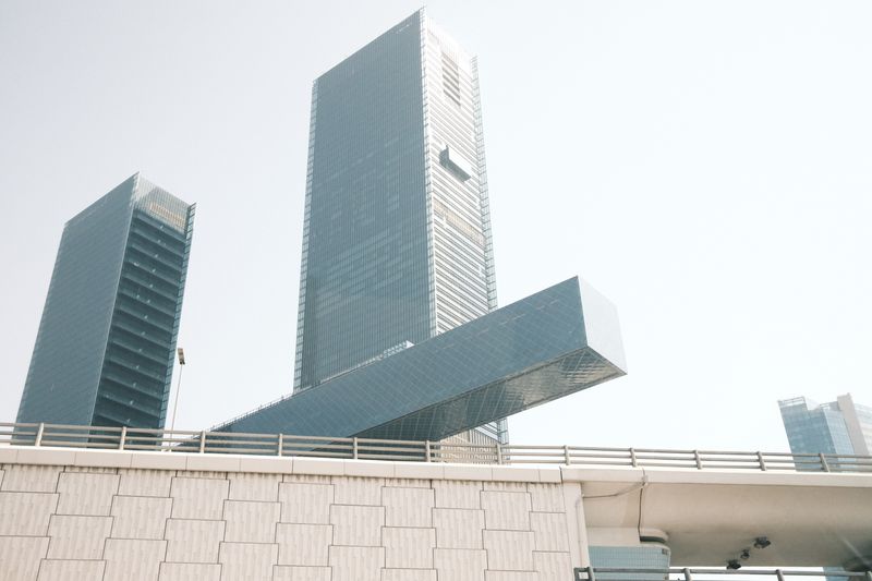 Sleek glass skyscrapers dominate the skyline of Dubai, showcasing modern architecture.