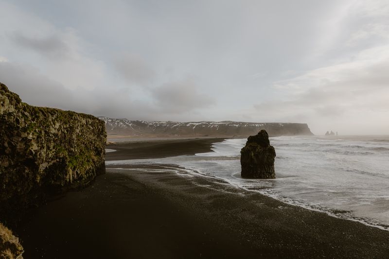 Explore the striking black sand beaches and rugged cliffs of Iceland's scenic coastline.