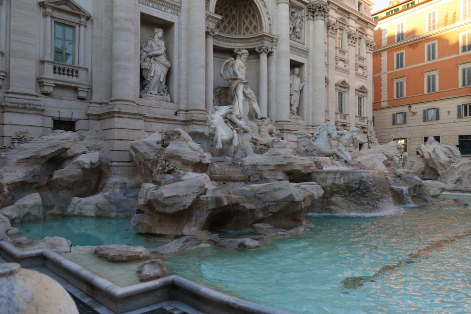 Captivating view of the Trevi Fountain in Rome, showcasing intricate sculptures and turquoise waters.